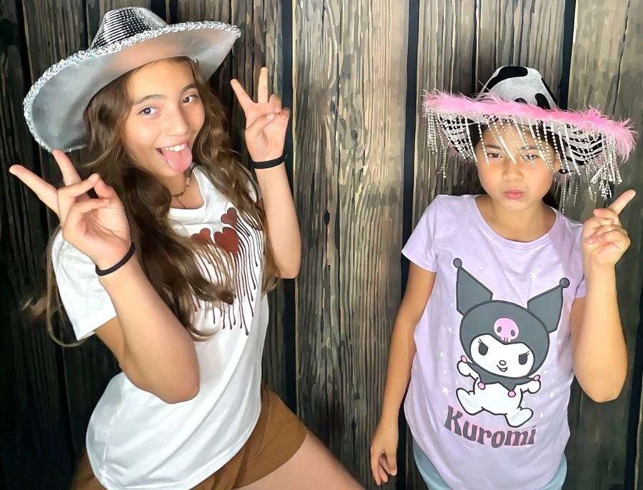 Friends pose at a birthday party.