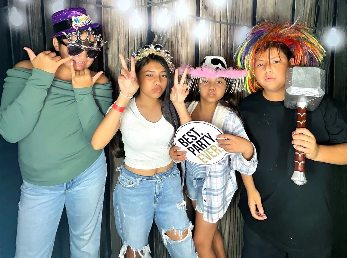 A family poses at a family celebration.