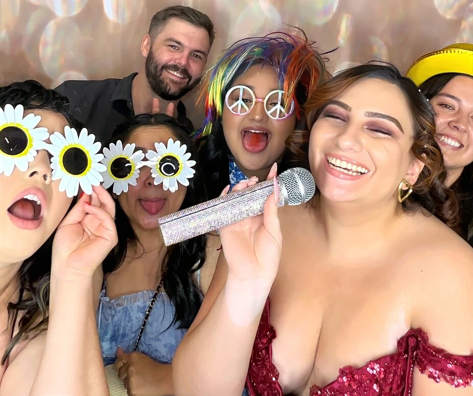 Party guests pose at a birthday party.