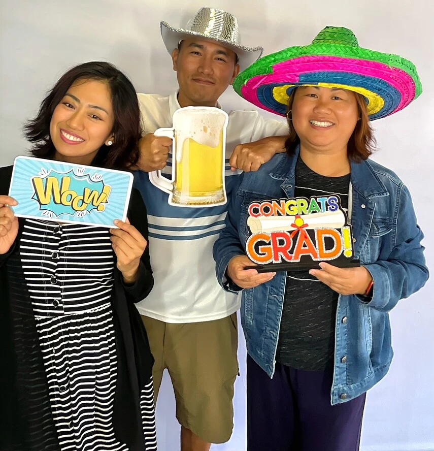 A family poses at a graduation celebration.