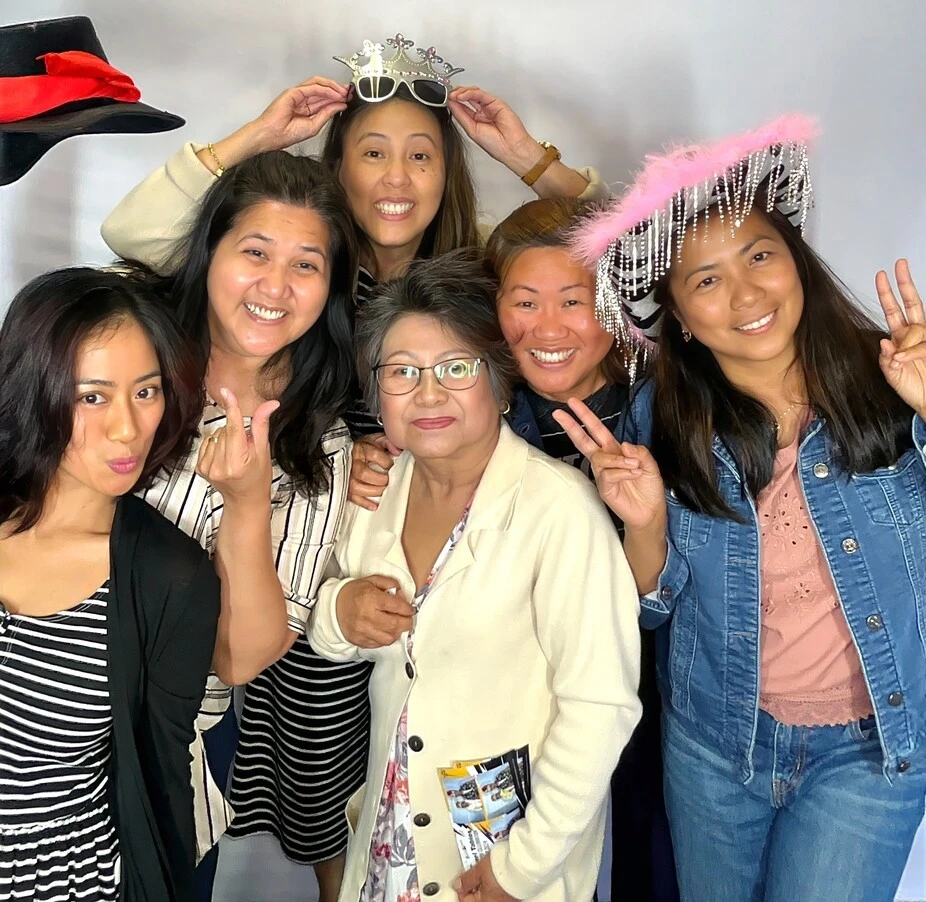 A family poses at a graduation celebration.