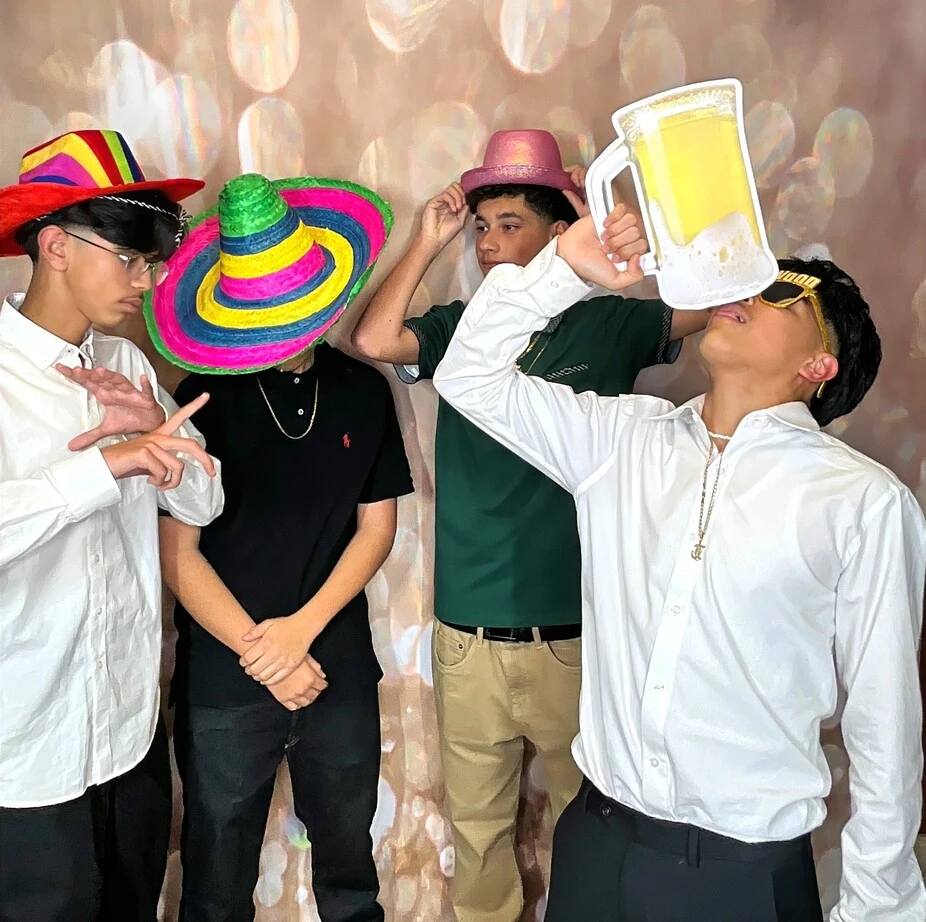 Friends pose at a quinceañera celebration.