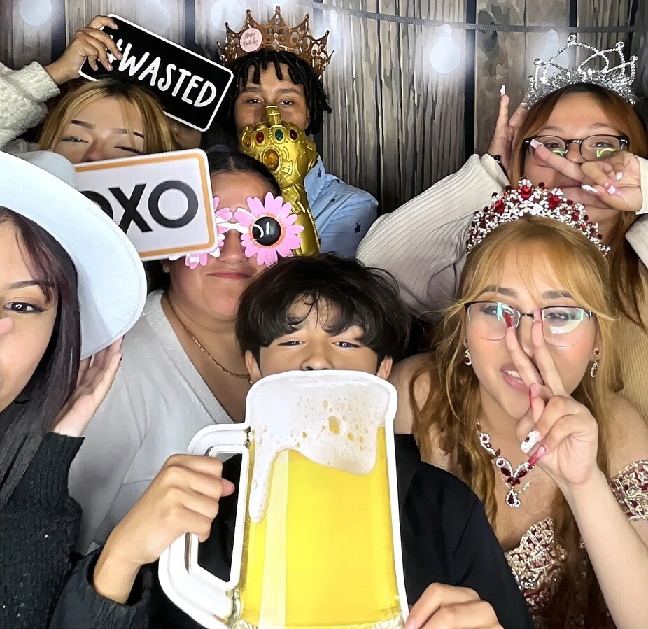 Friends pose at a quinceañera celebration.