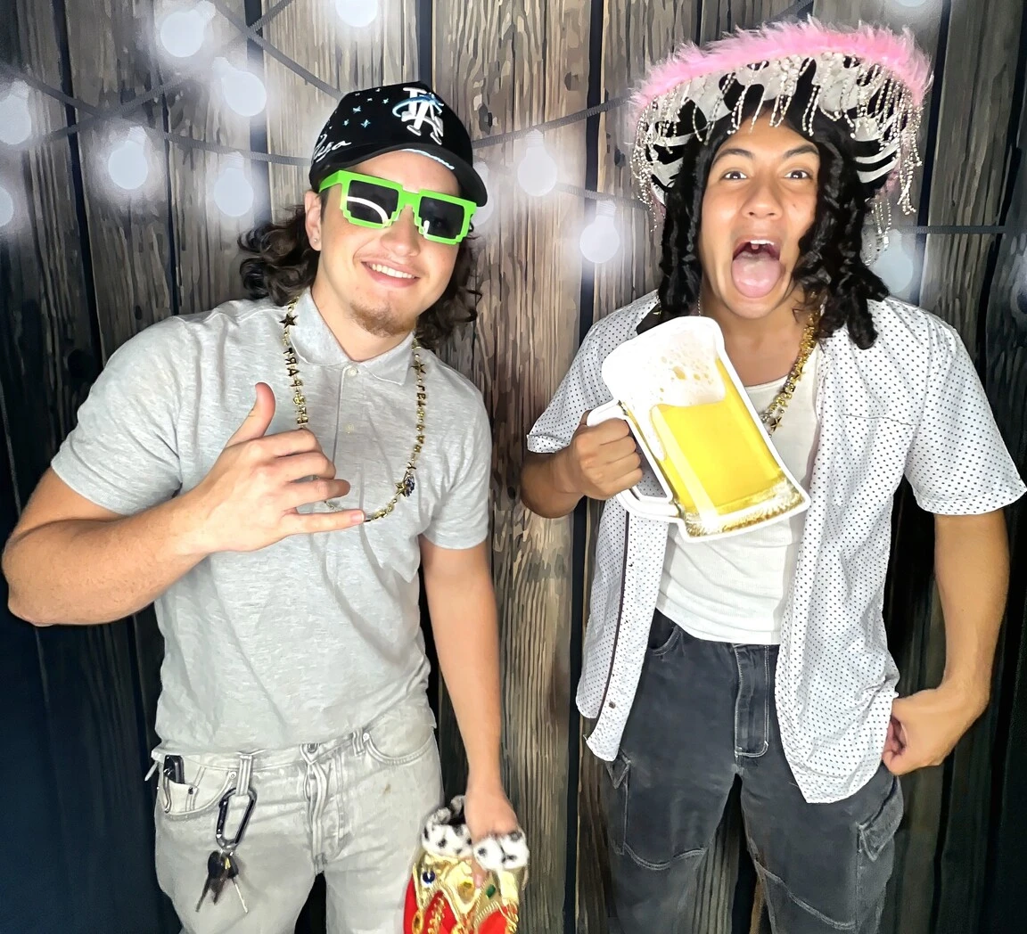 Teen friends pose at a birthday party.