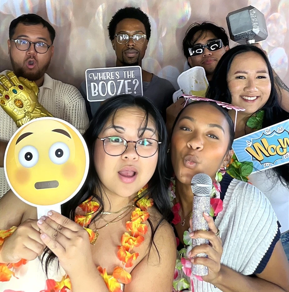 Friends pose at a birthday party.