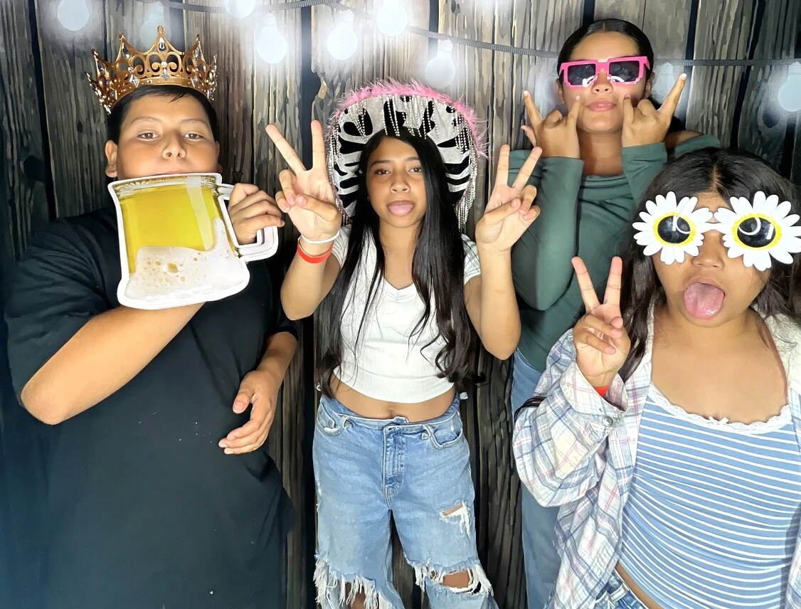 A family poses at a birthday party.
