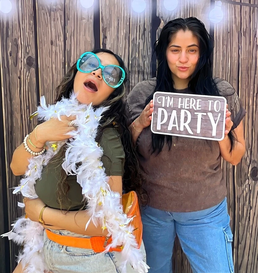 Friends pose at a birthday party.