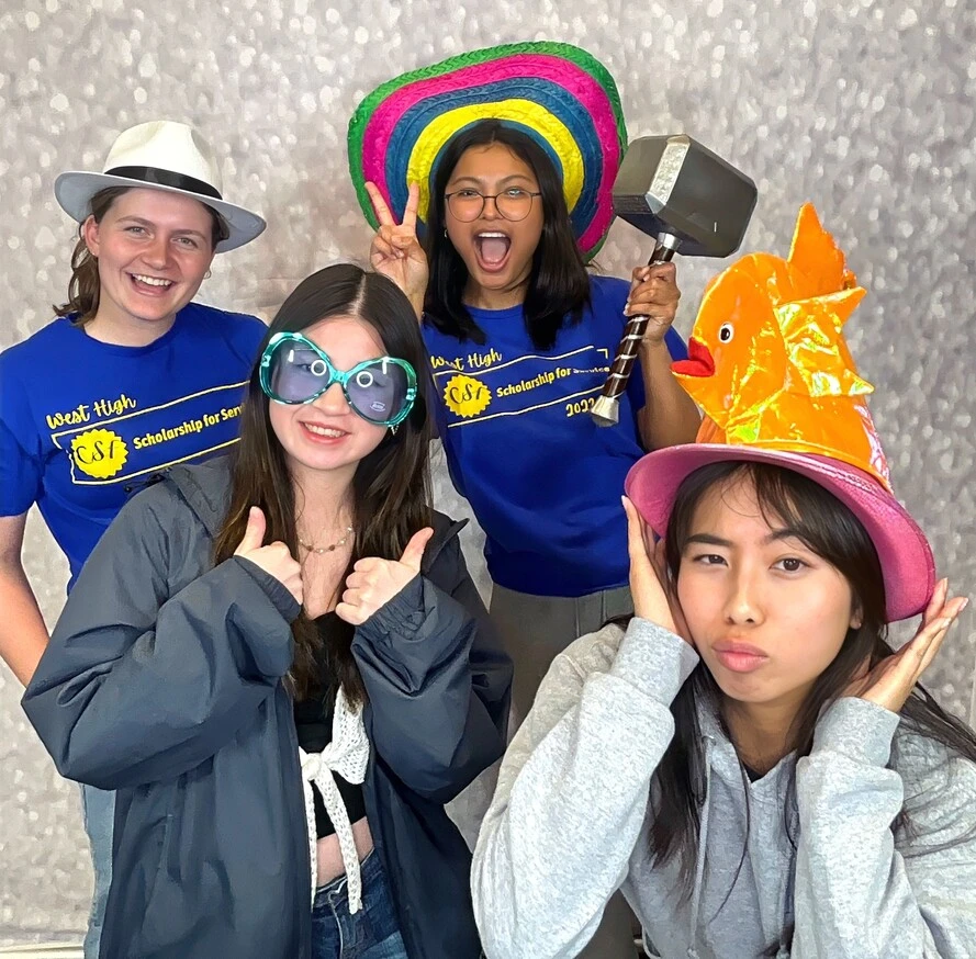Coworkers pose at a team event.
