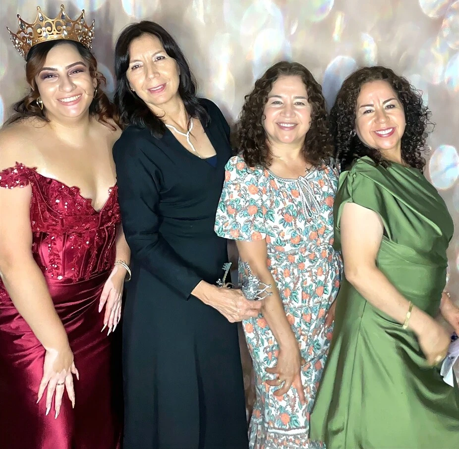 A family poses at a family celebration.
