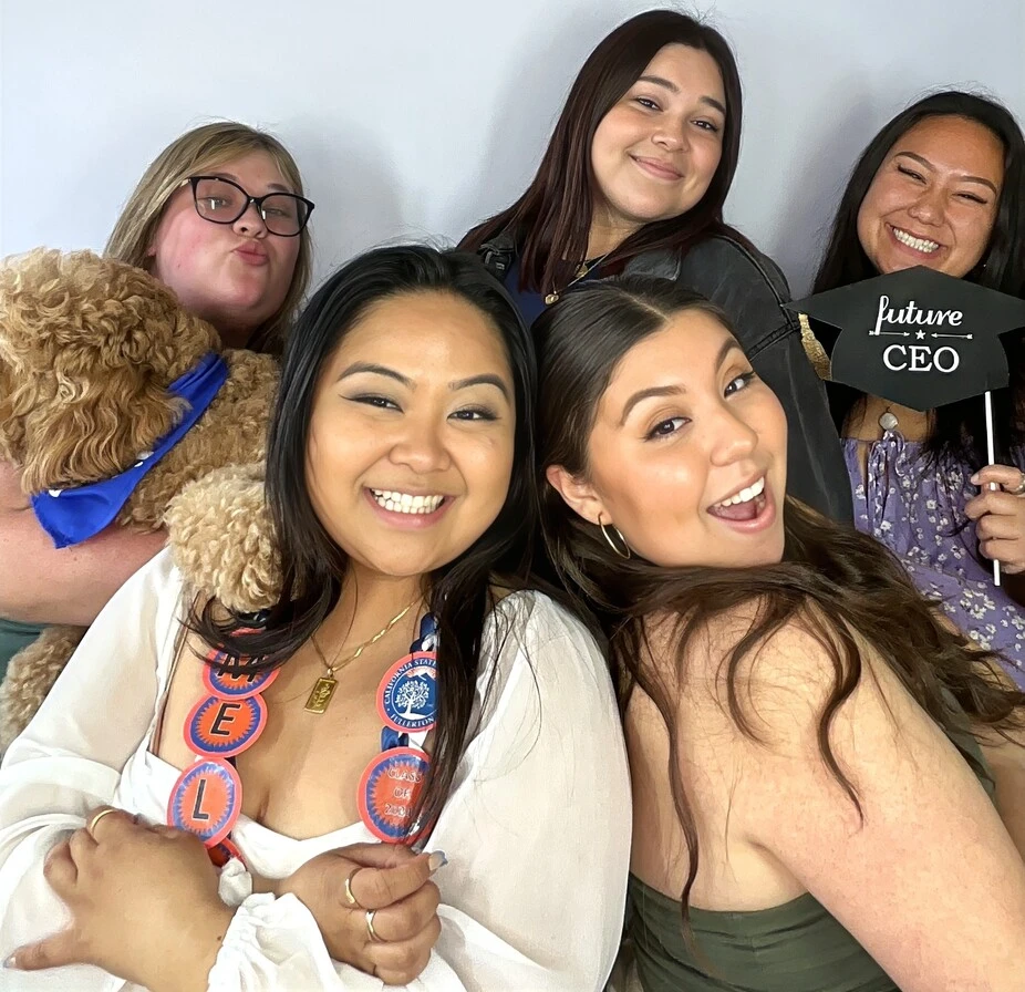 A family poses at a graduation celebration.