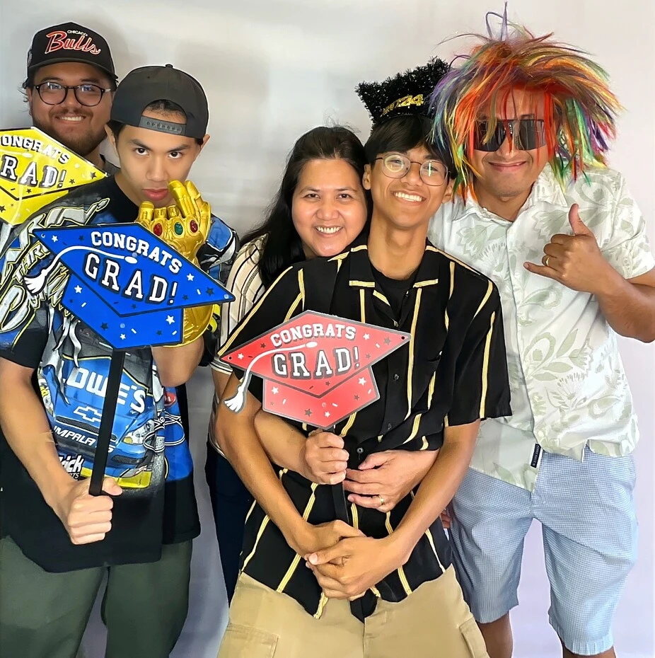 Guests pose at a graduation celebration.