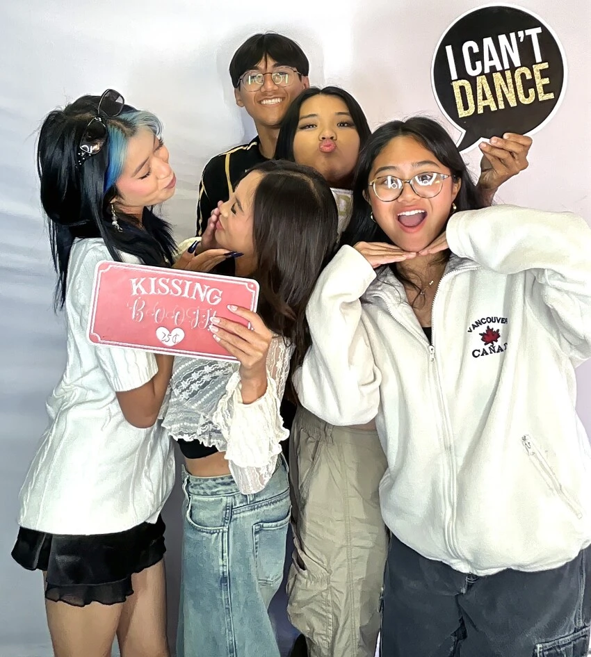 A group of guests poses at a graduation celebration.