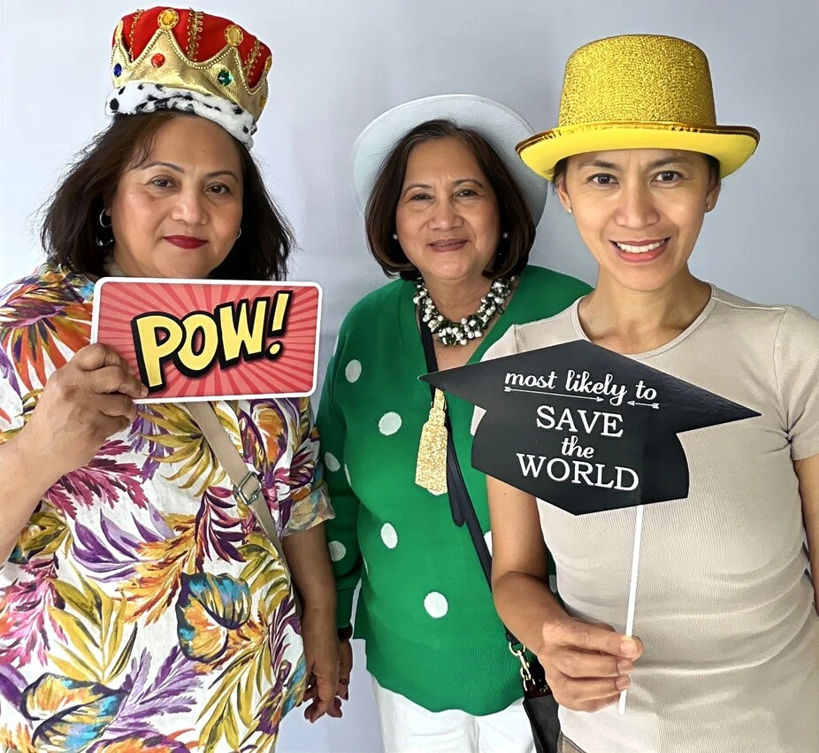 Party guests pose at a graduation celebration.