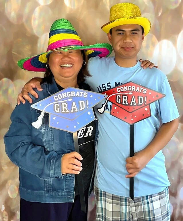 A family poses at a graduation celebration.
