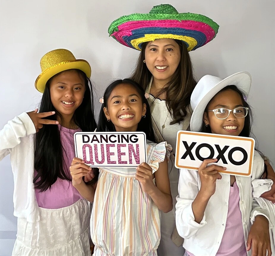 Friends pose at a graduation celebration.