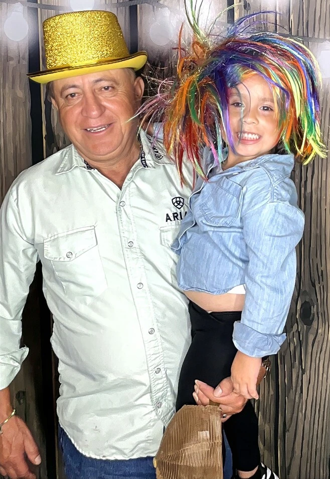 A family poses at a quinceañera celebration.