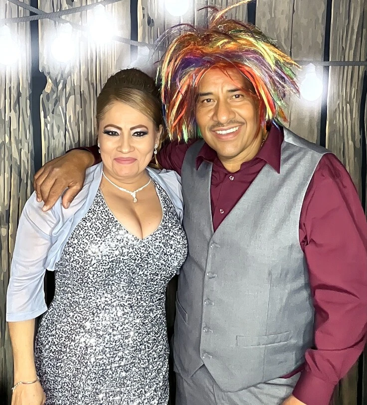 A family poses at a quinceañera celebration.