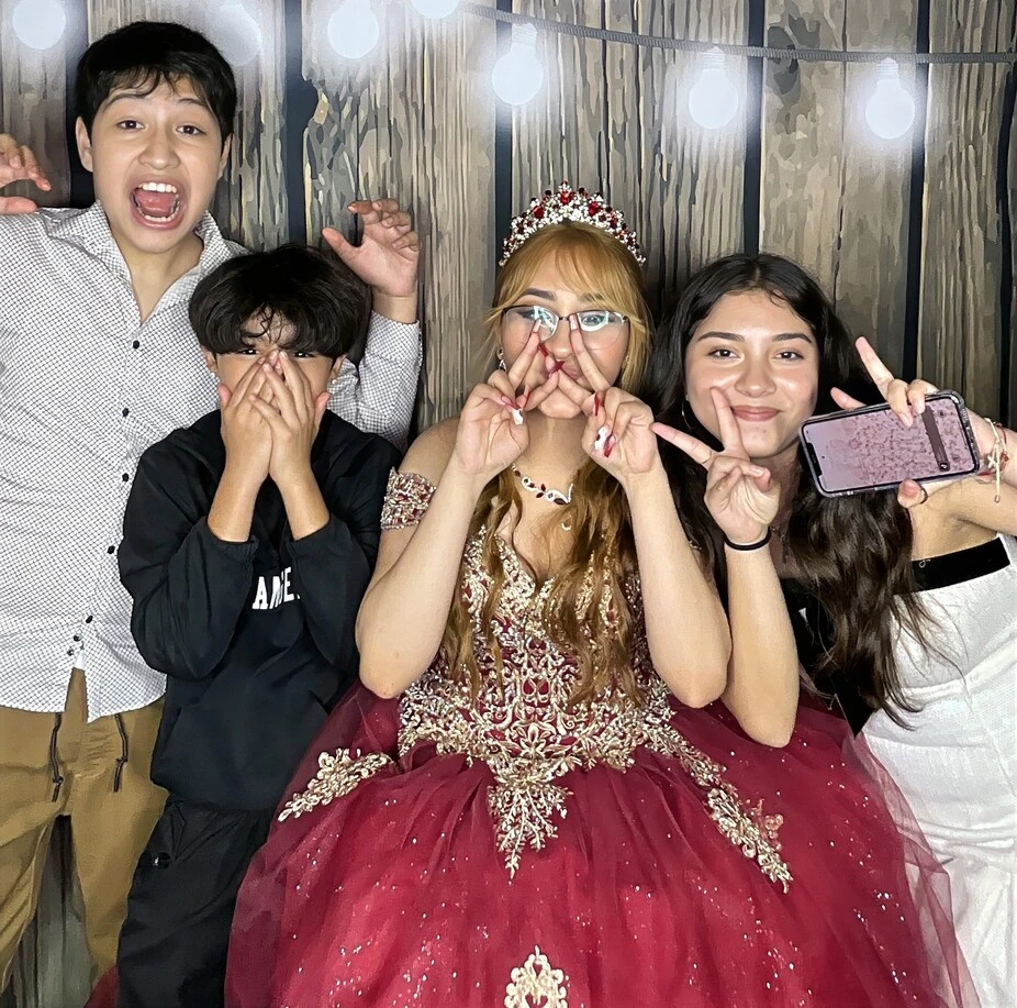 Guests pose at a quinceañera celebration.
