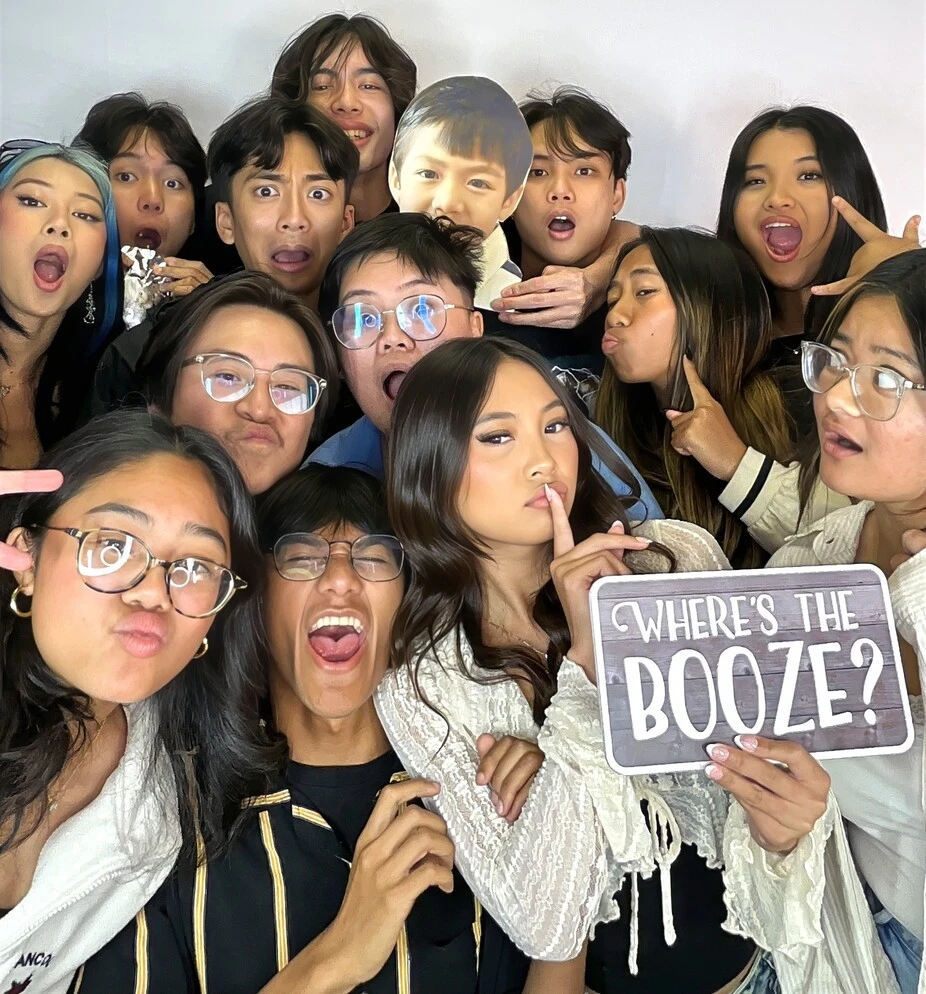 Guests pose at a graduation celebration.