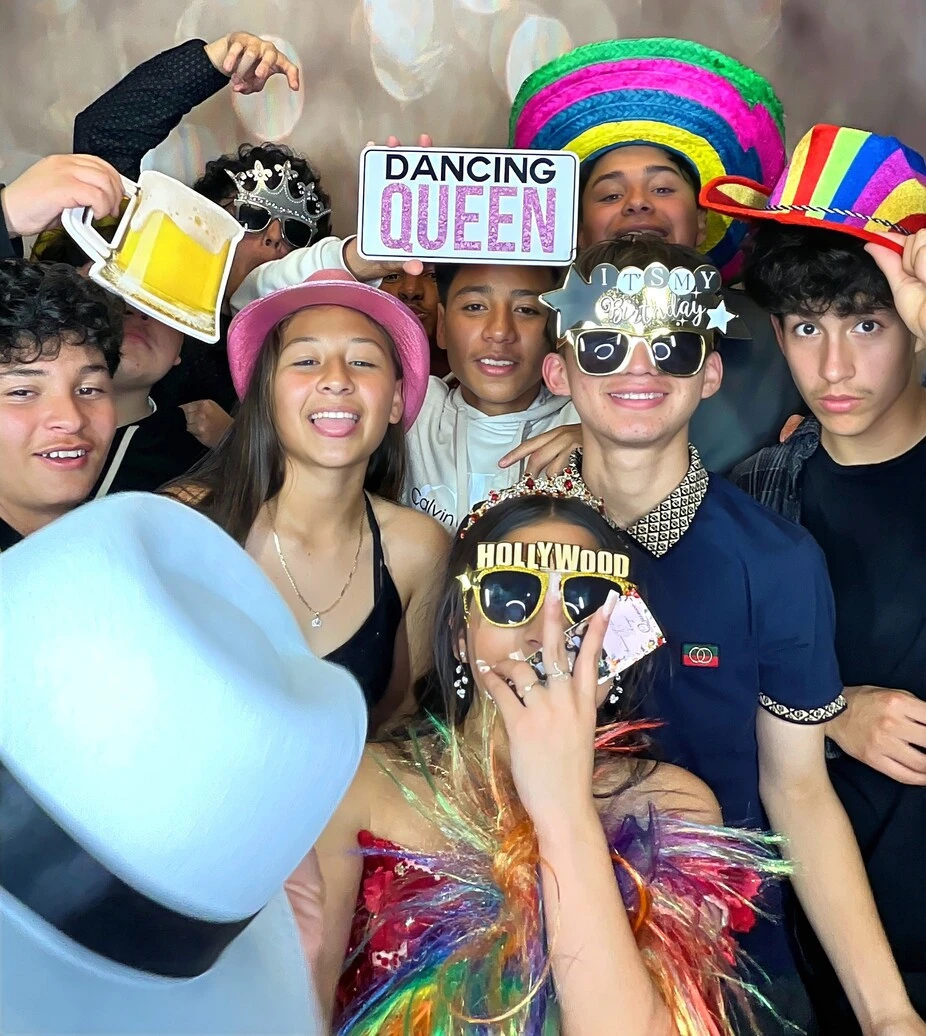 Friends pose at a quinceañera celebration.