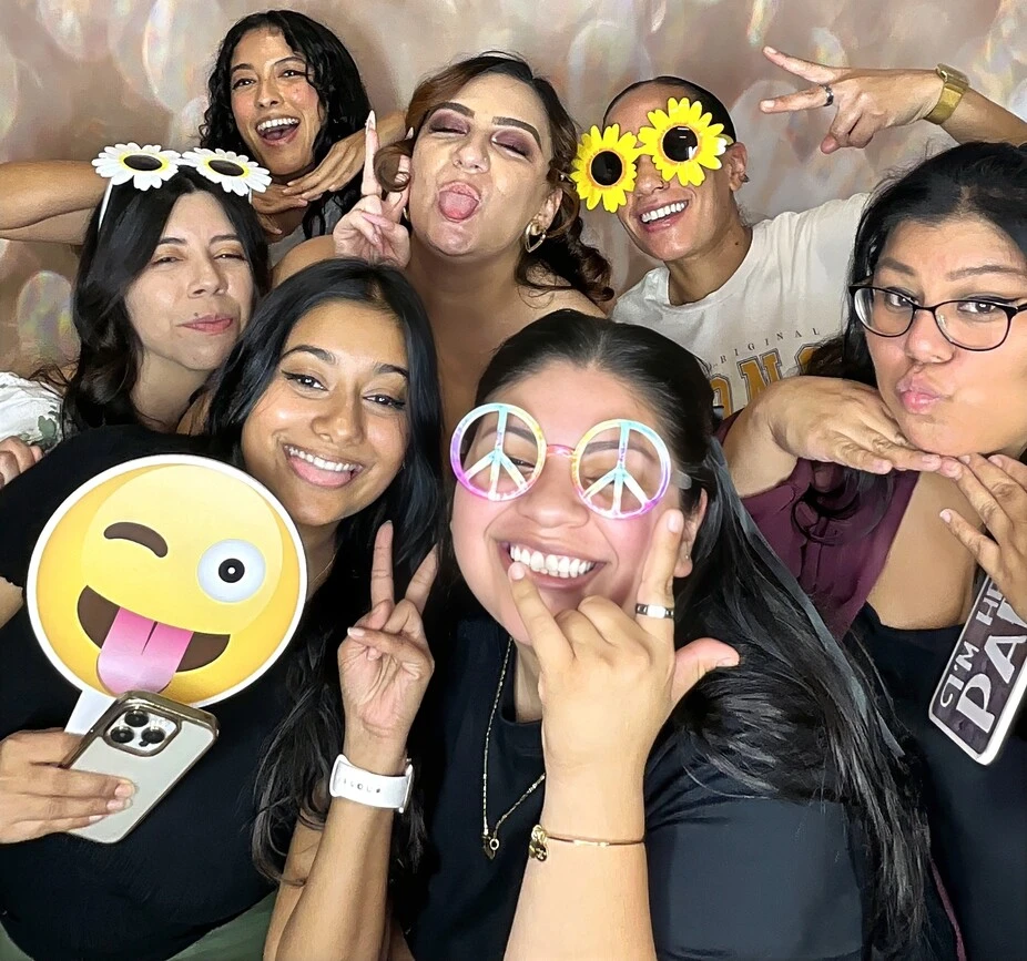 A family poses at a birthday party.