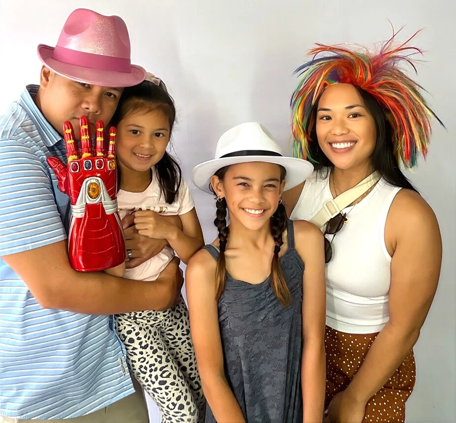 A family poses at a family celebration.