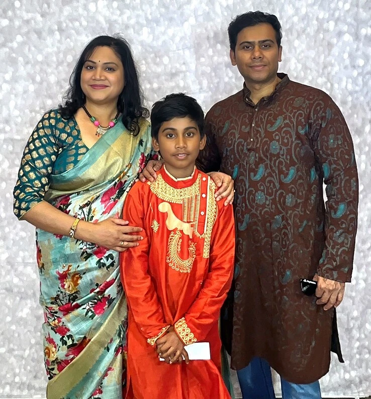 A family poses at a family celebration.