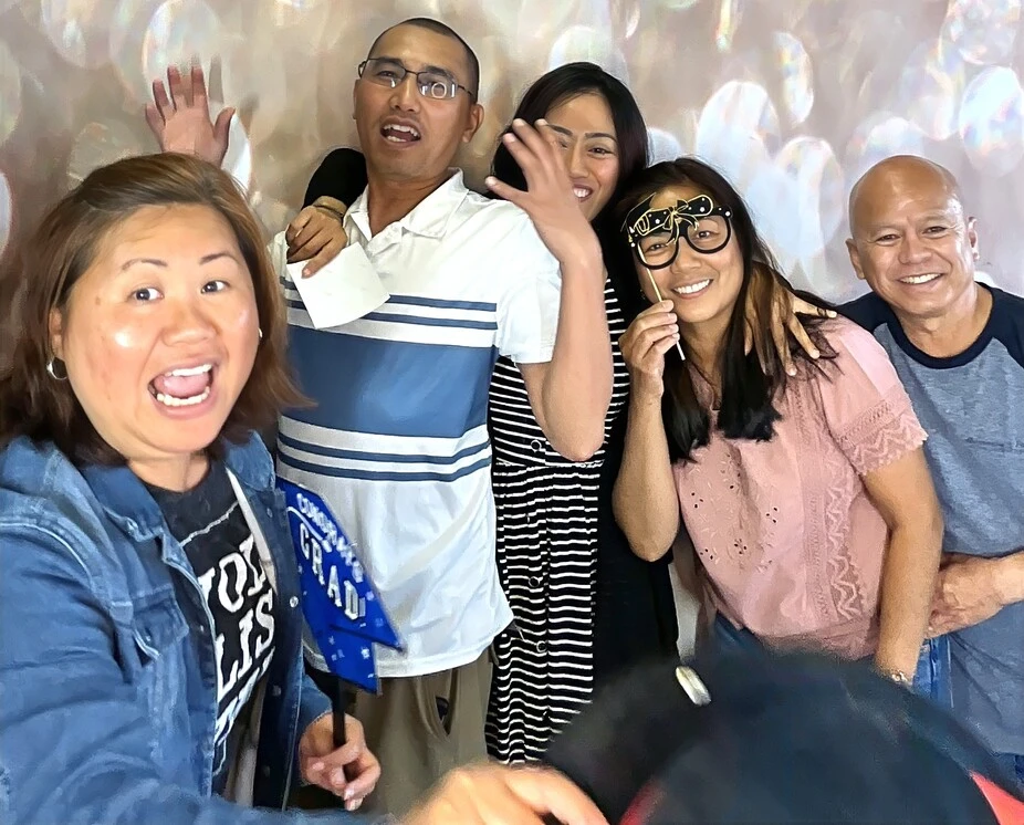 Friends pose at a graduation celebration.