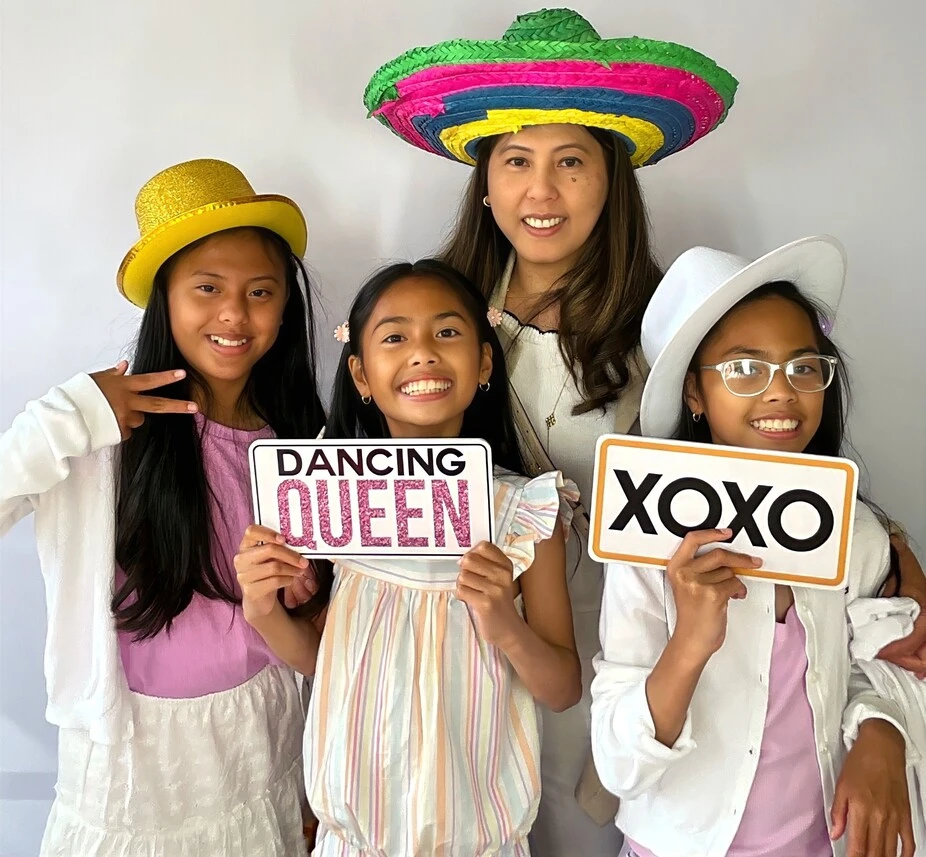 Guests pose at a graduation celebration.