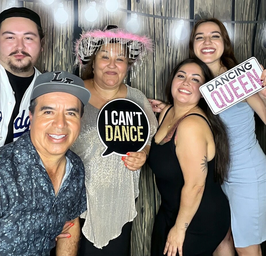 Guests pose at a quinceañera celebration.