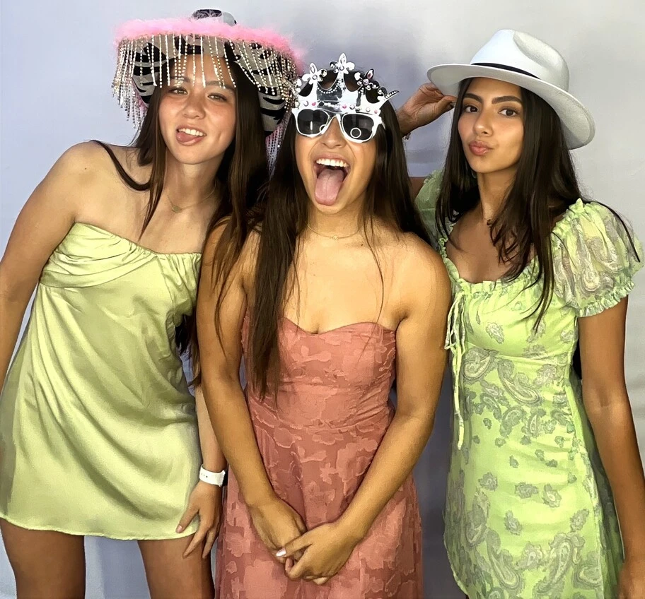 Party guests pose at a Sweet 16 celebration.