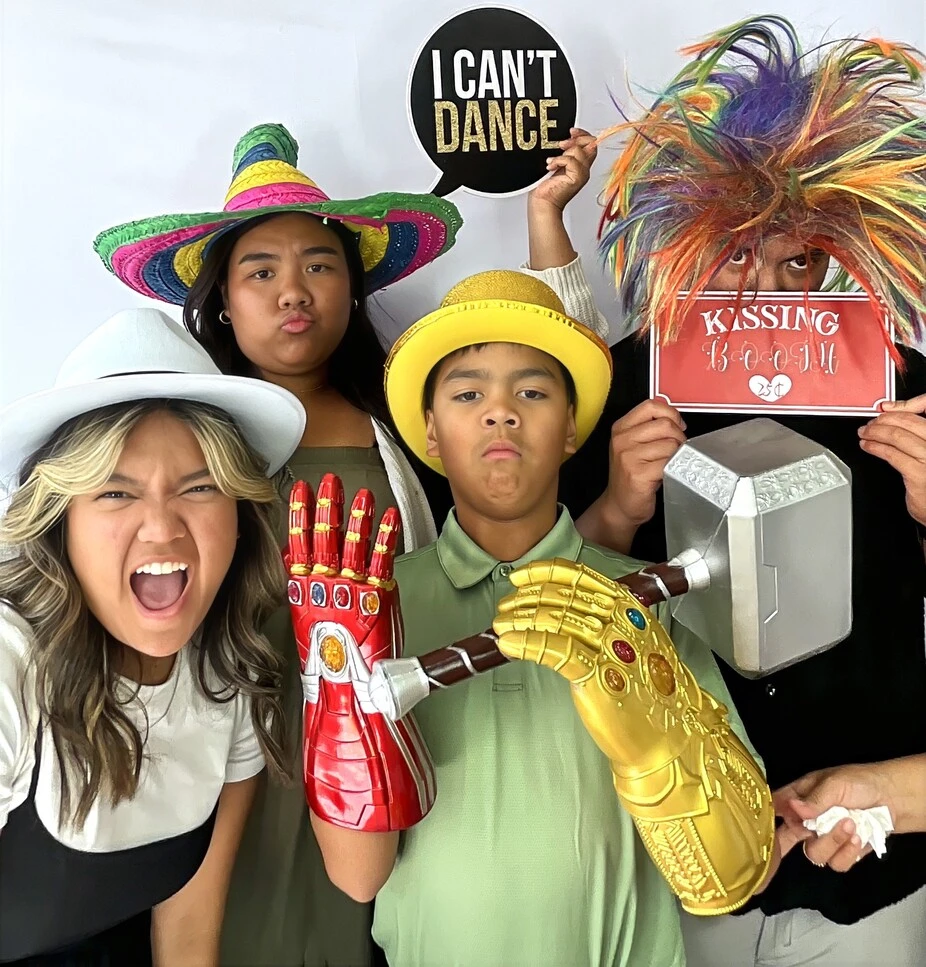 Party guests pose at a birthday party.
