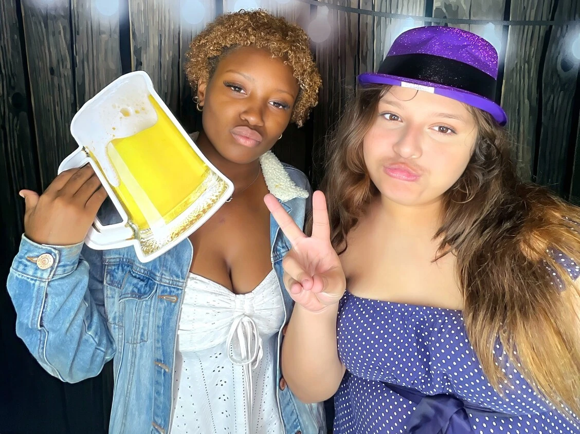 Party guests pose at a birthday party.