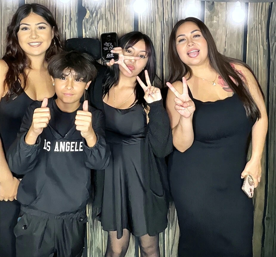 A family poses at a family celebration.