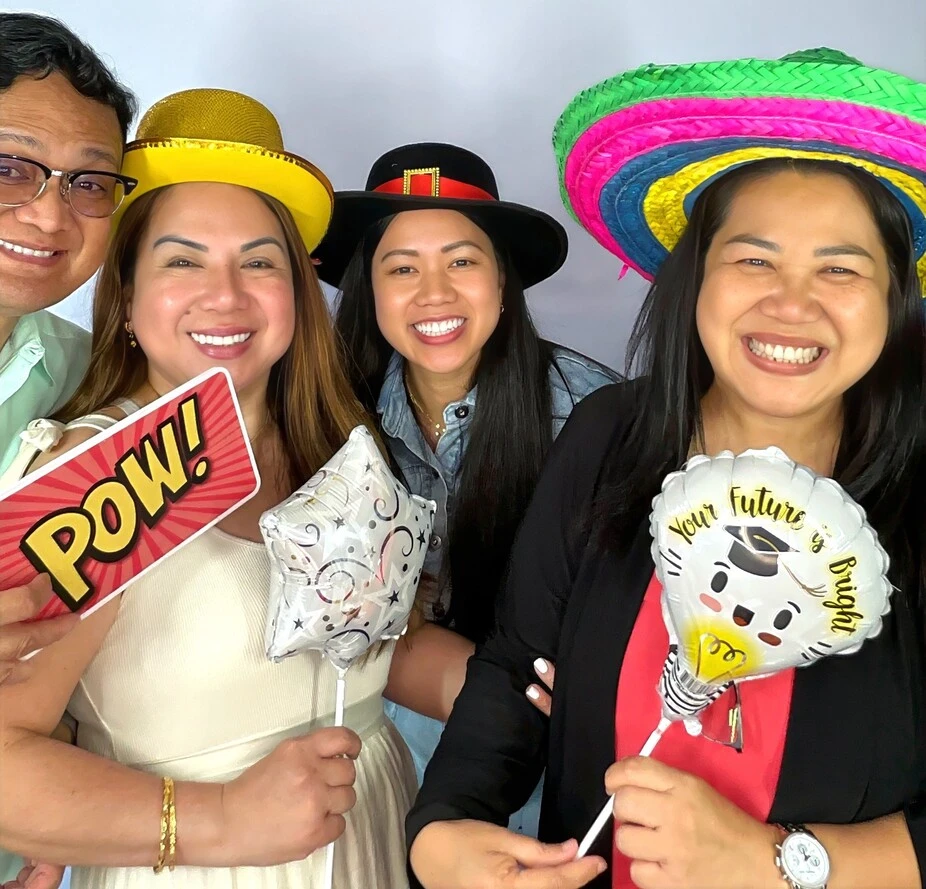 Guests pose at a graduation celebration.