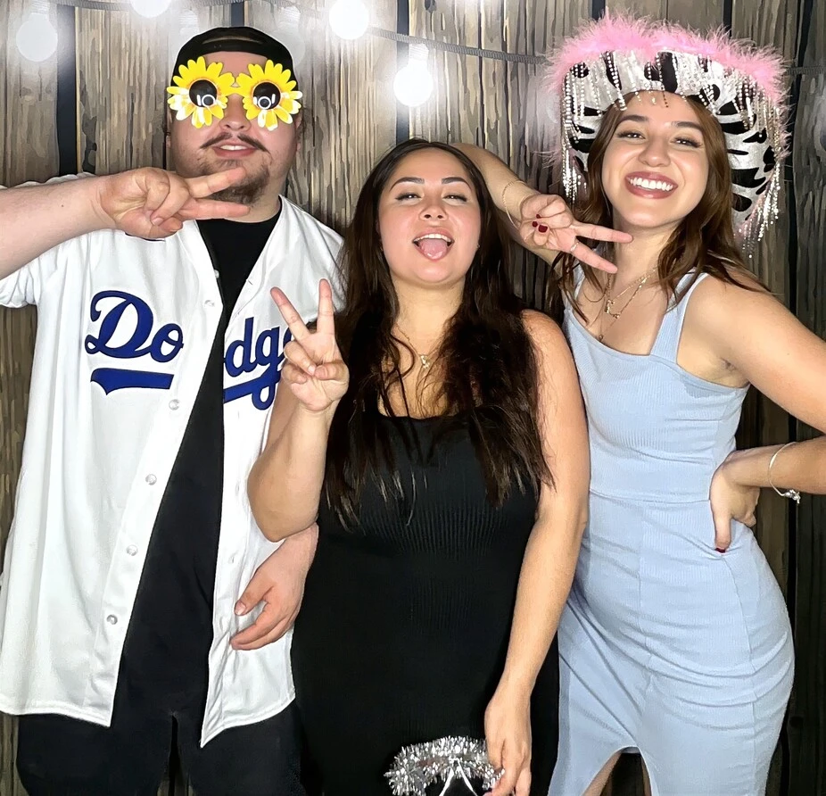 Friends pose at a quinceañera celebration.