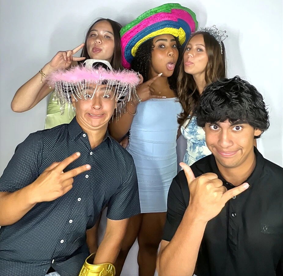 Teen friends pose at a Los Angeles celebration.